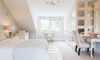 Loft bedroom with built-in dressing area